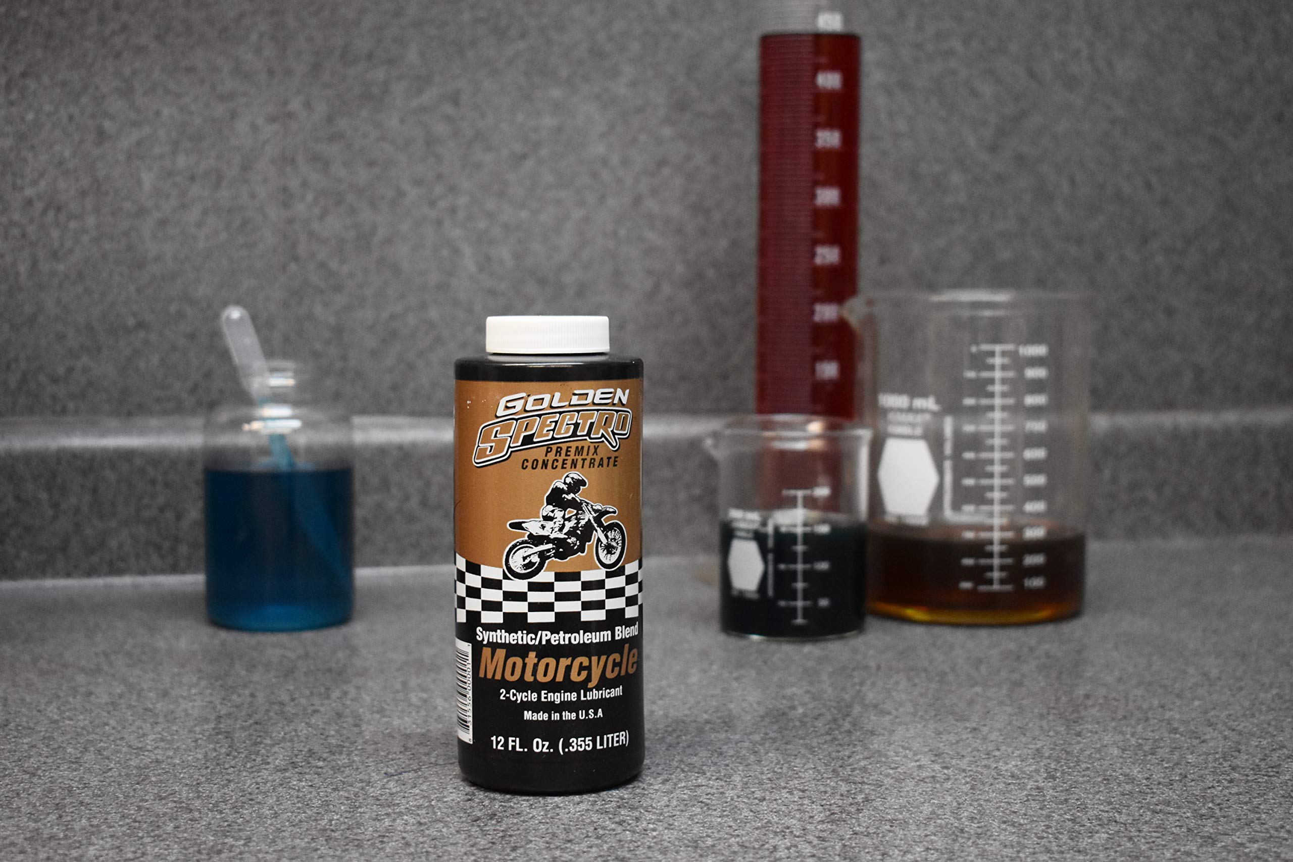 Spectro Oil cap and bottle texture close-up showing spill-resistant design benefit