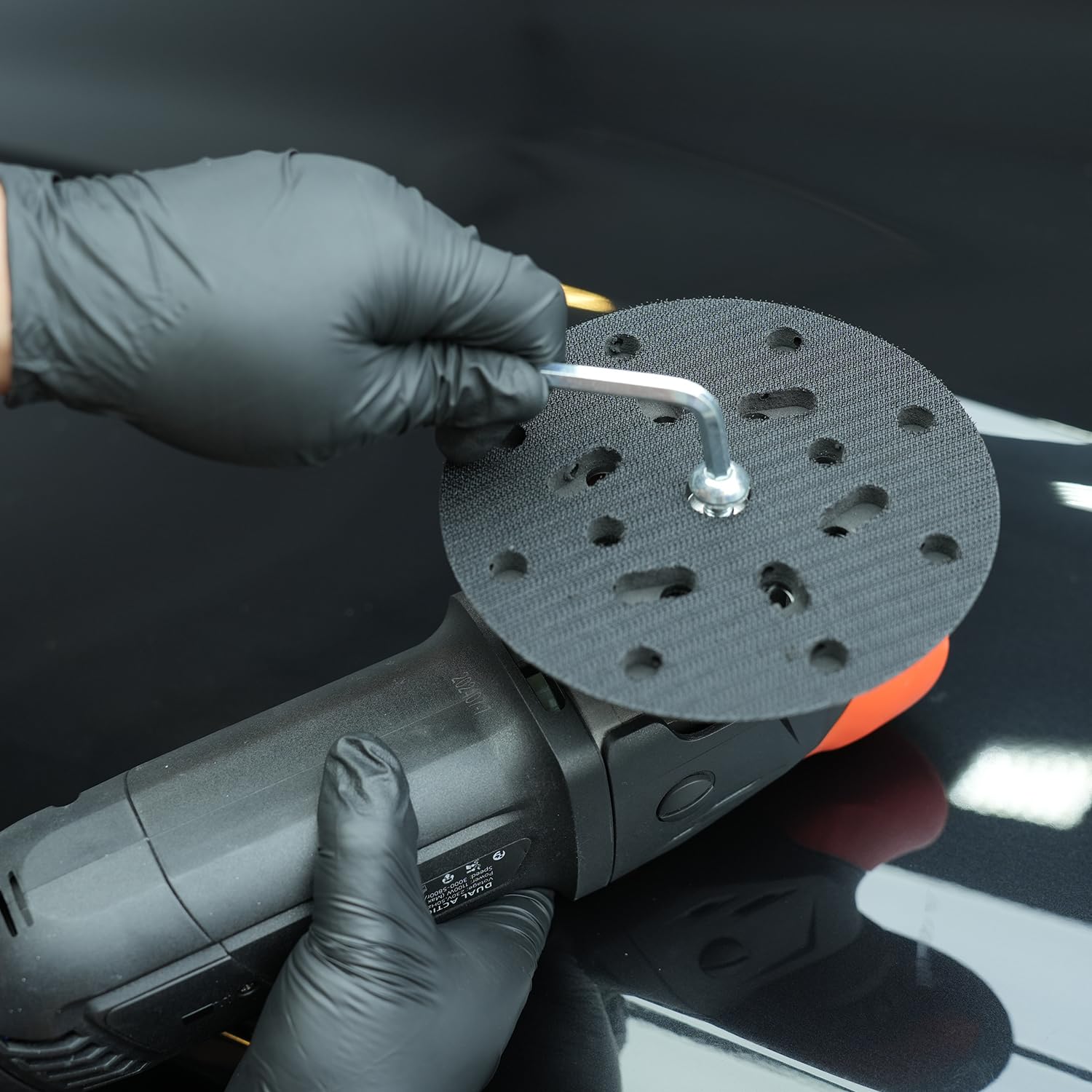 SPTA plate next to DA polisher showing scale and fit for up to 12,000 OPM machines