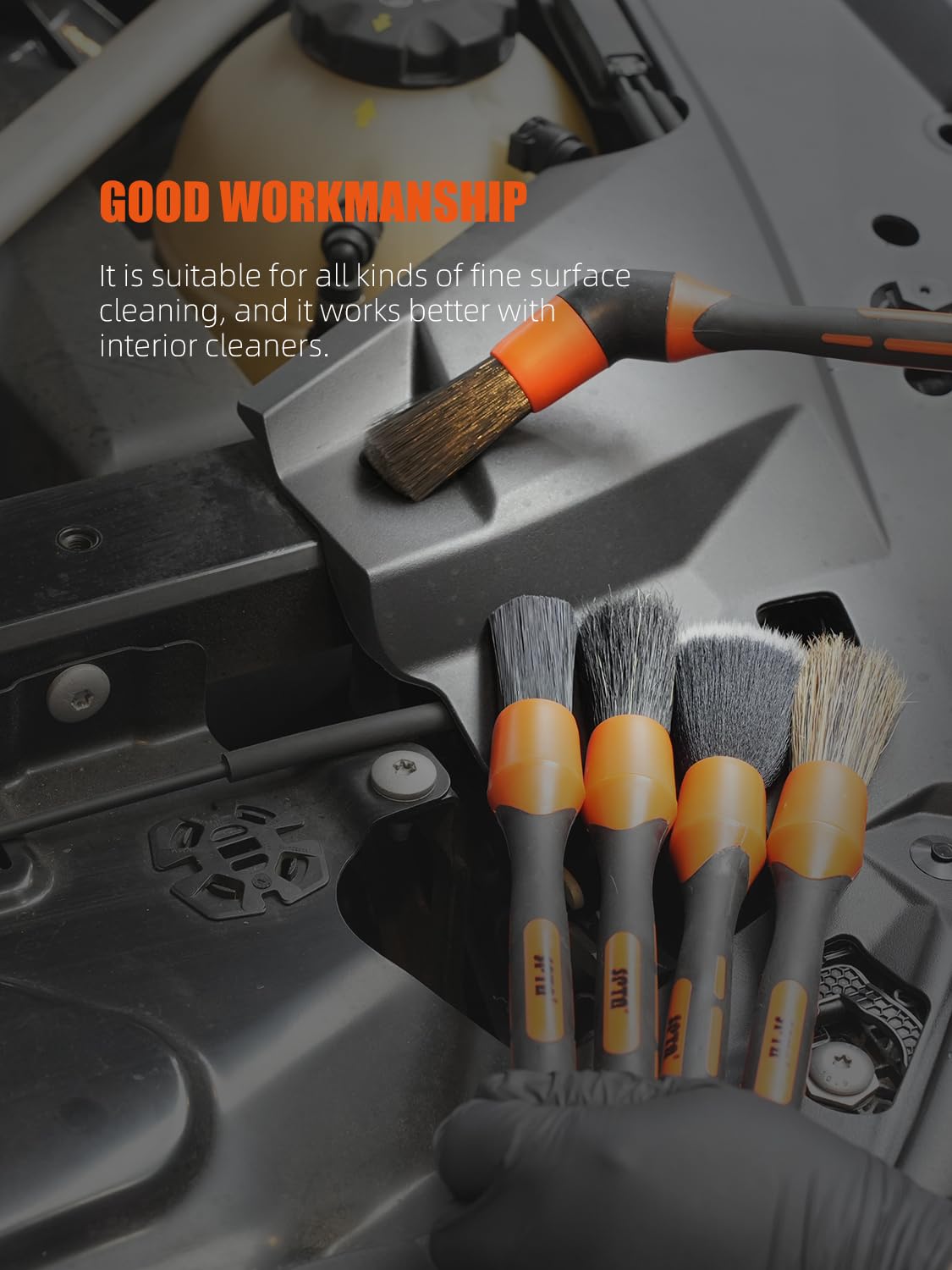 SPTA brushes held in hand to show scale and ergonomic grip for controlled detailing
