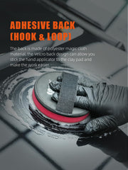 SPTA clay pad in handheld use removing contaminants and smoothing paint