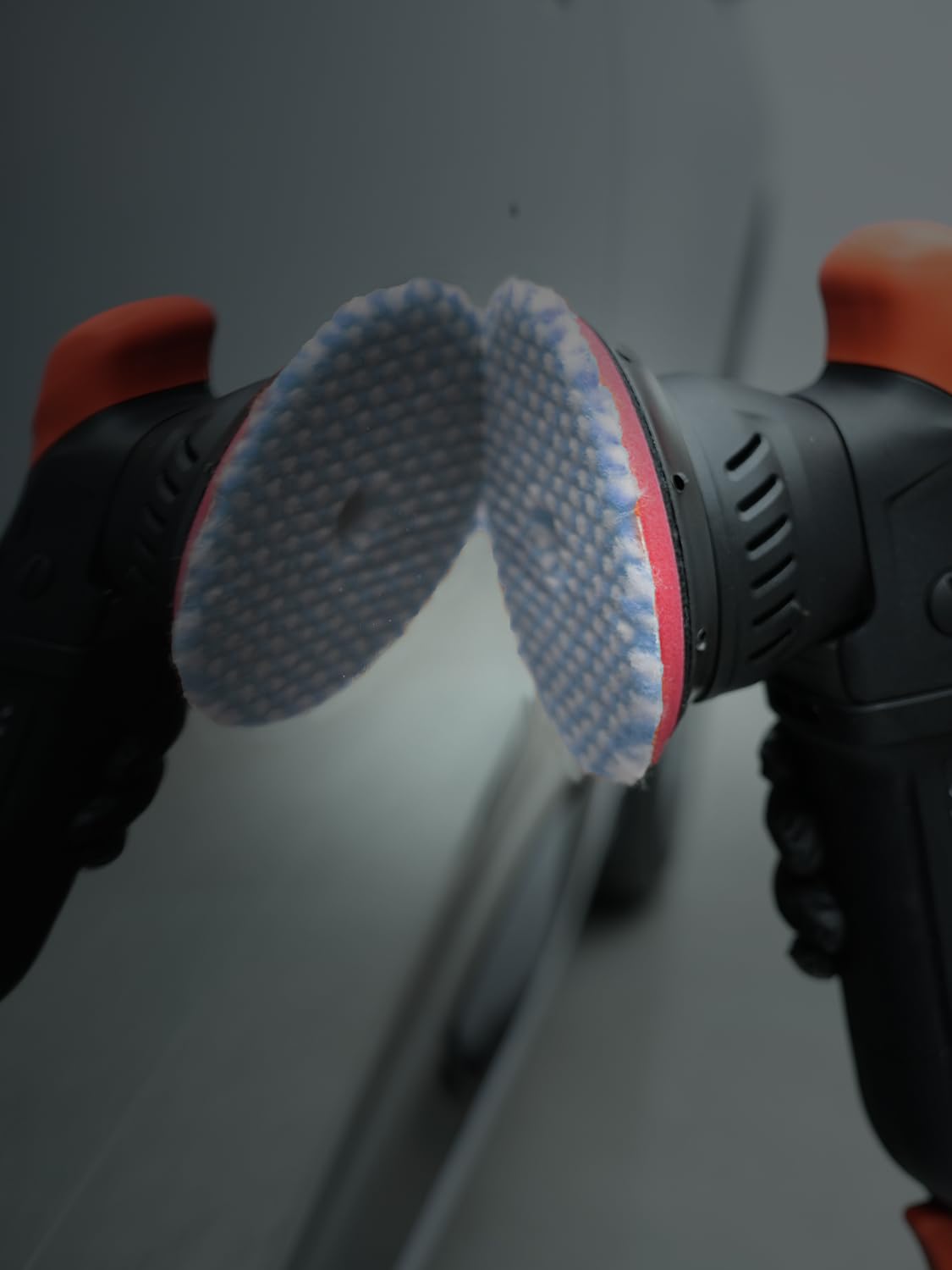 SPTA pad in a detailing garage showing professional-grade finish workflow benefit