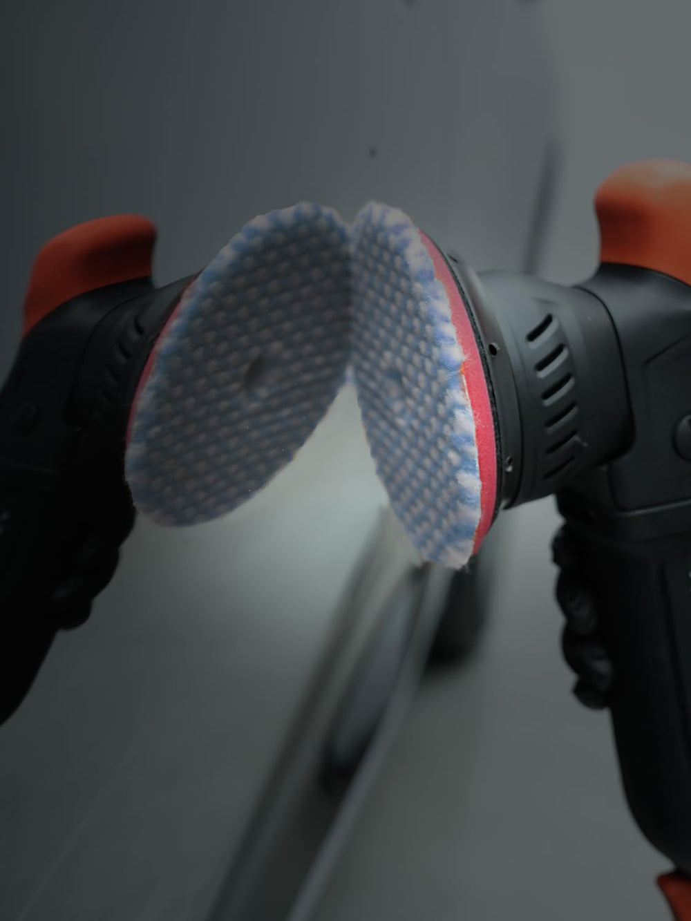 SPTA pad in a detailing garage showing professional-grade finish workflow benefit