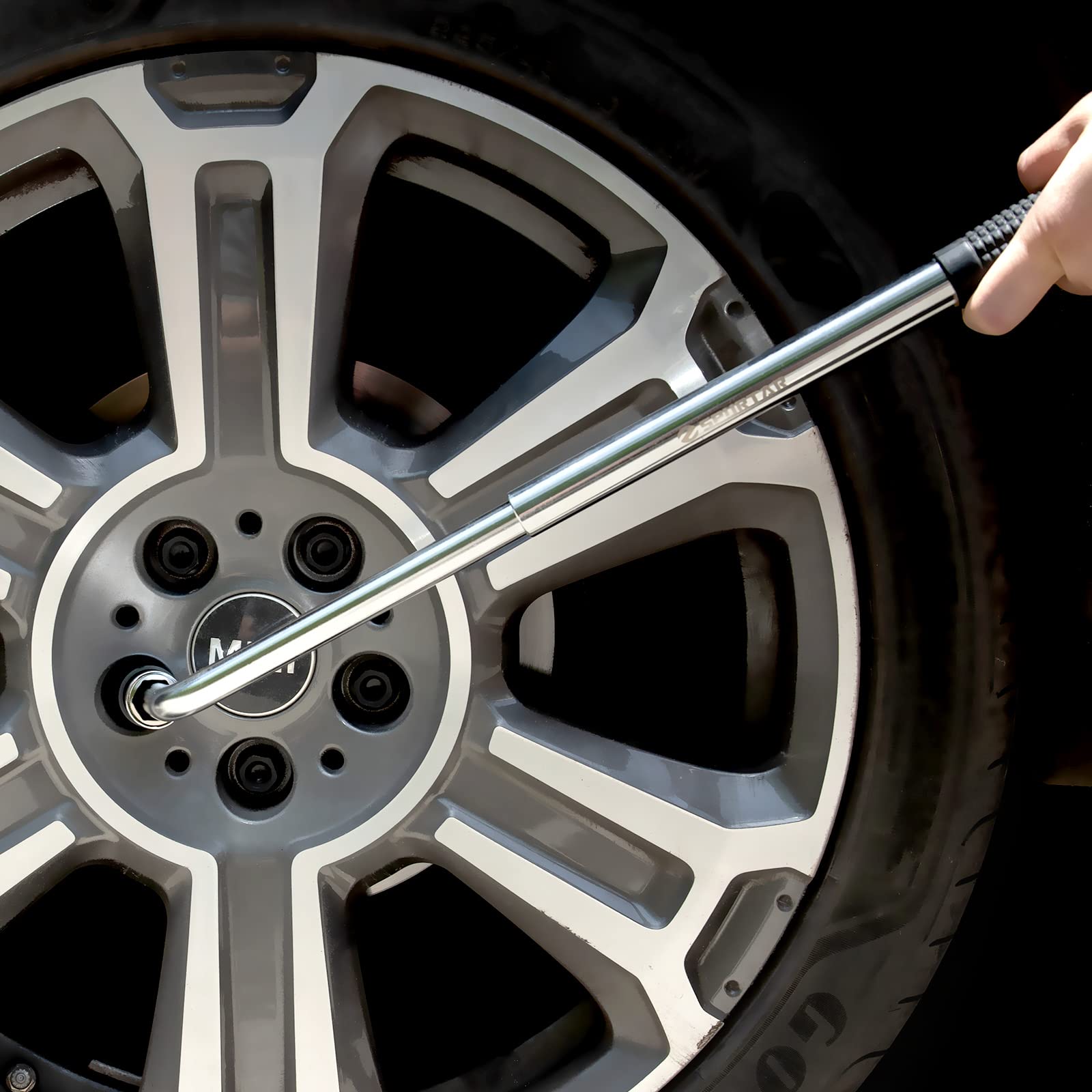 Spurtar extended wrench in hand demonstrating increased leverage