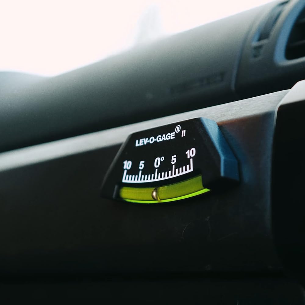 Sun Company lev-o-gage II next to ruler showing compact size for space-saving installation