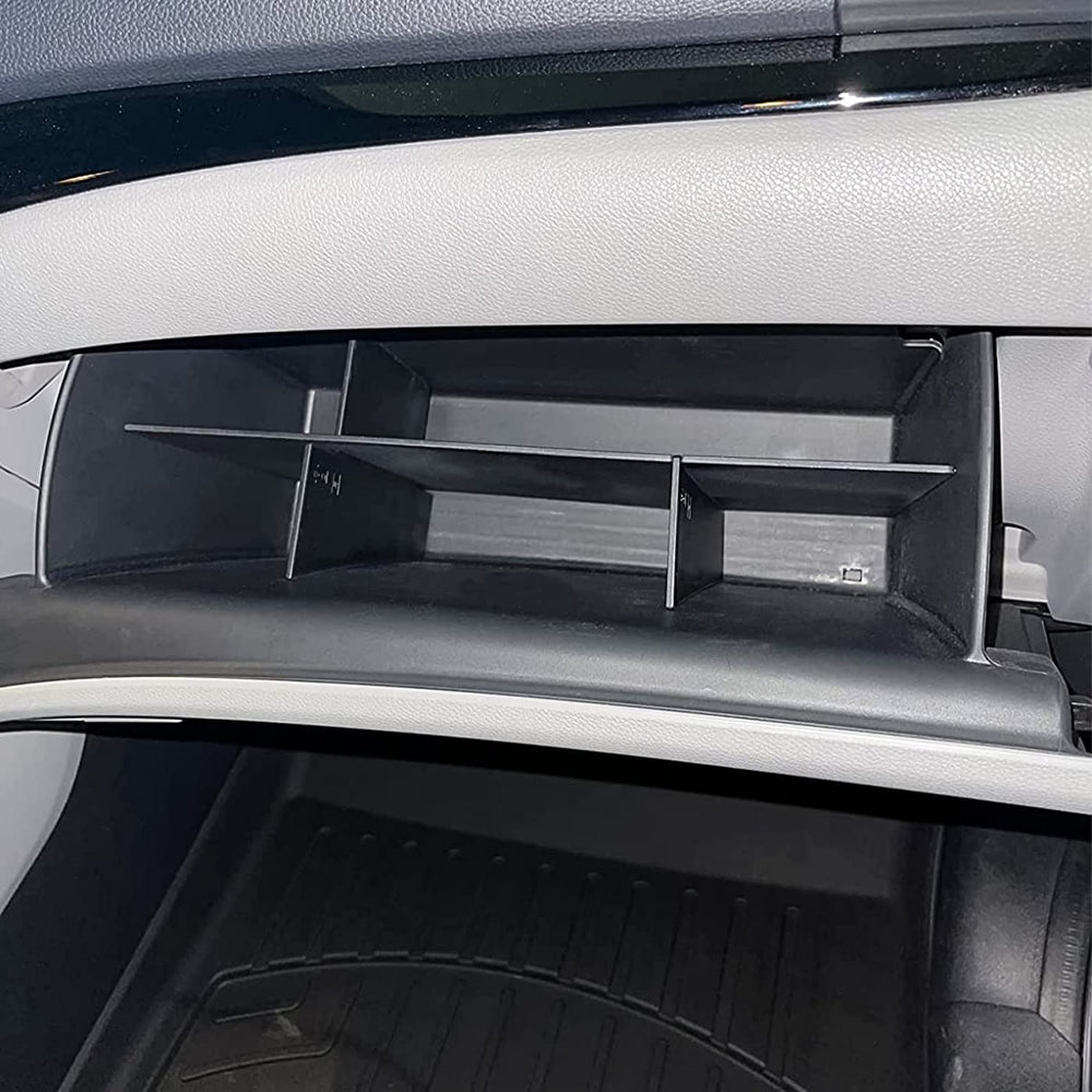 TACOBRO lower compartment detail holding owner's manual and larger items securely