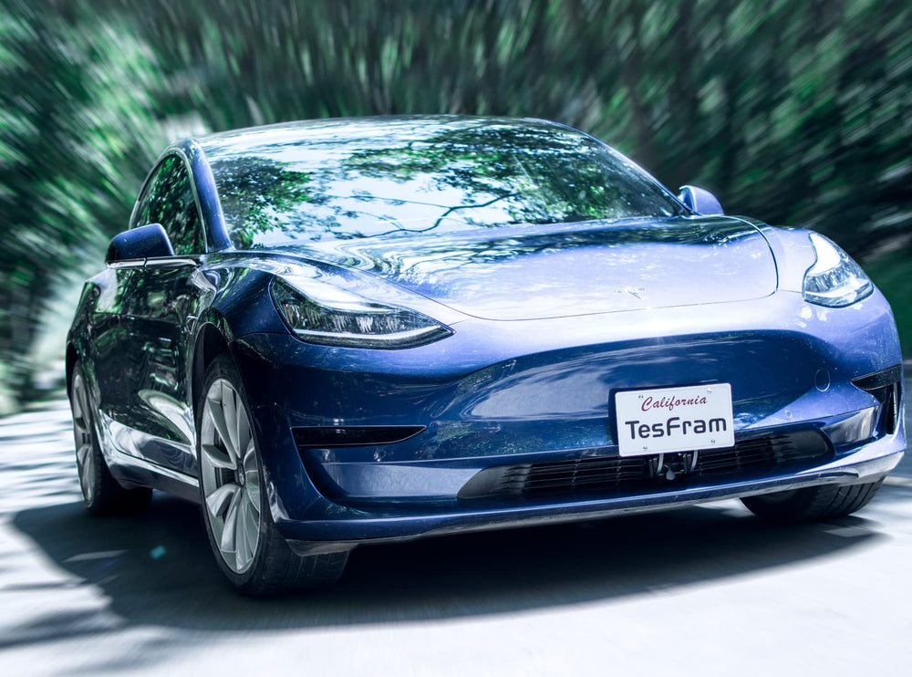TesFram lifestyle shot on Model 3 driveway illustrating clean aesthetic benefit