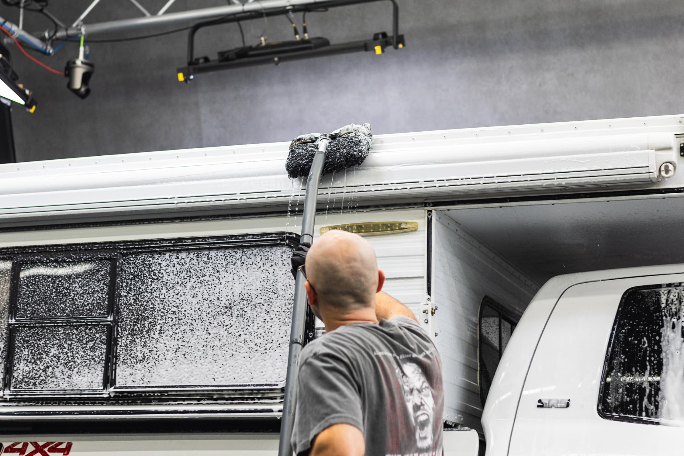 The Rag Company extension in use cleaning a car roof for safe reach