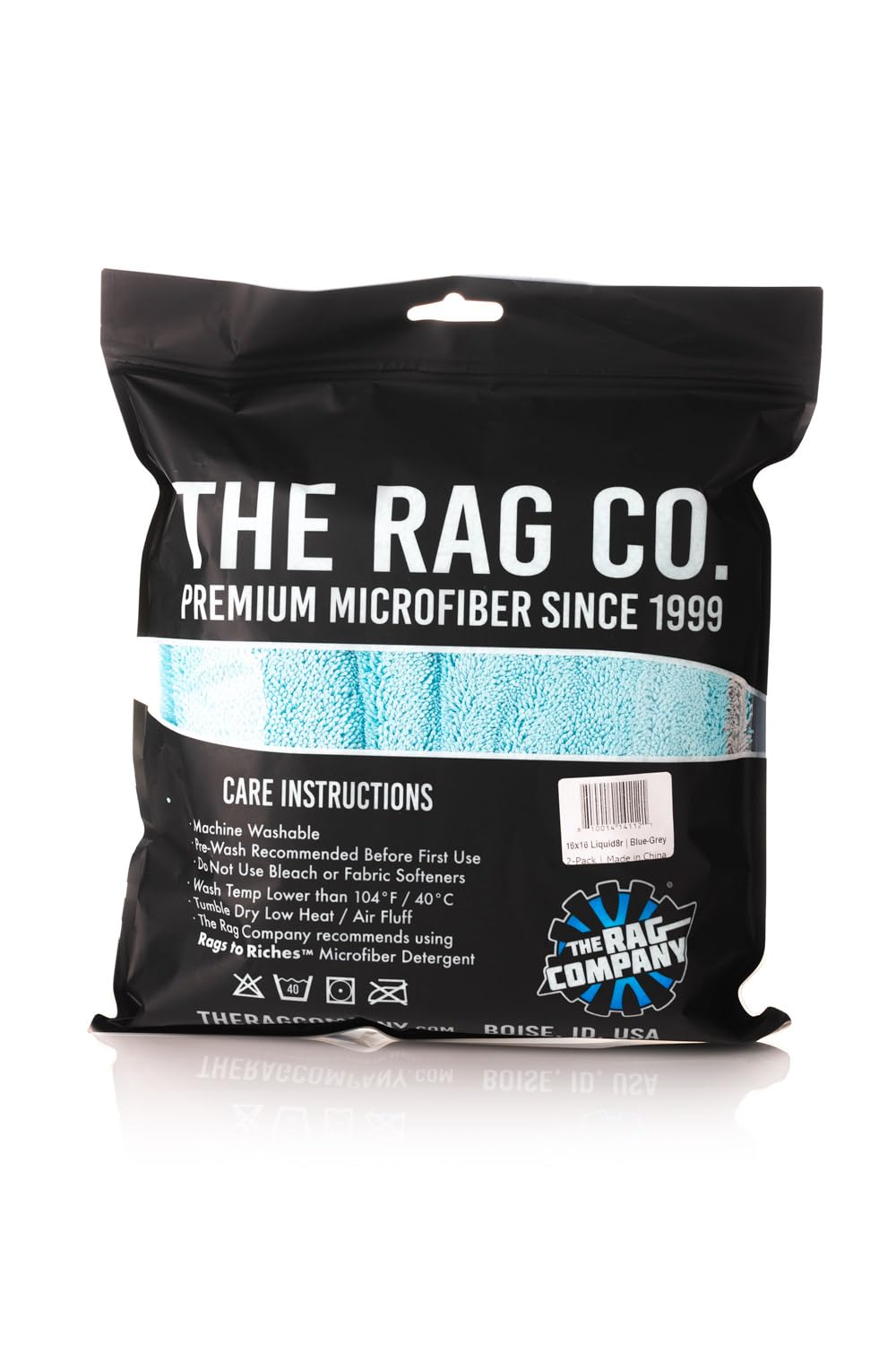 Laundry care label on The Rag Company towel showing recommended washing guidance