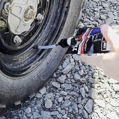 TireJect being injected into a tire valve for fast repair
