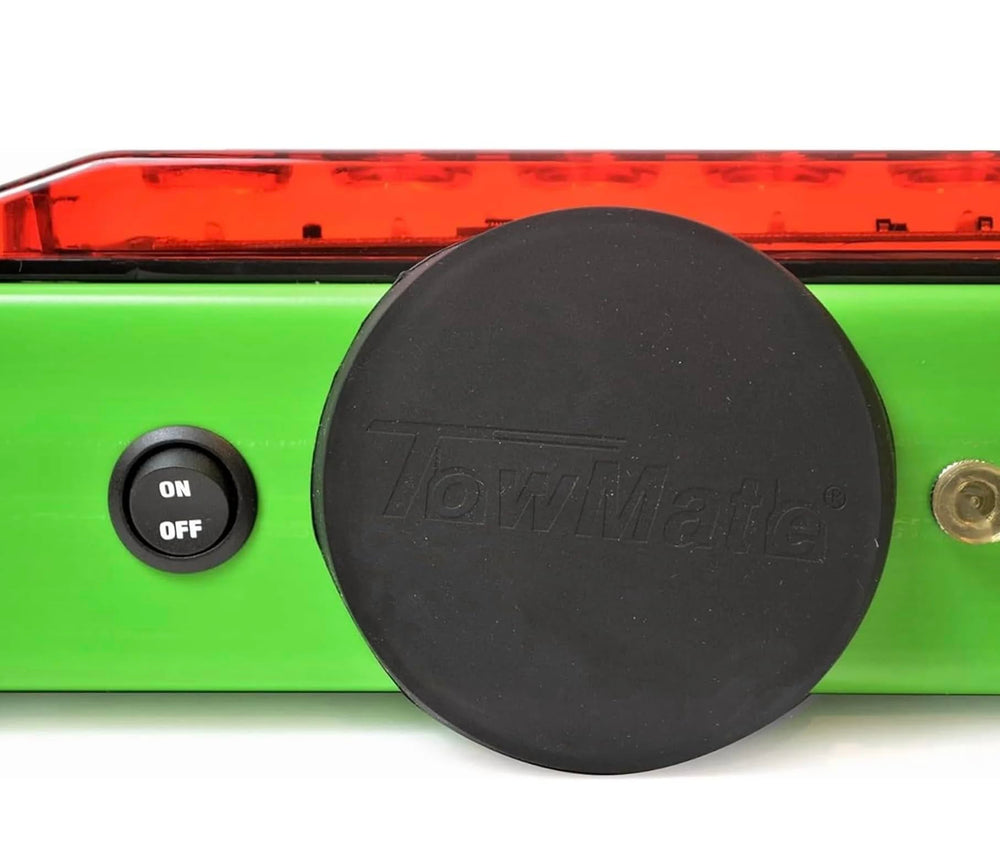 TowMate battery label showing 12V 1.3Ah capacity for up to ten hour runtime