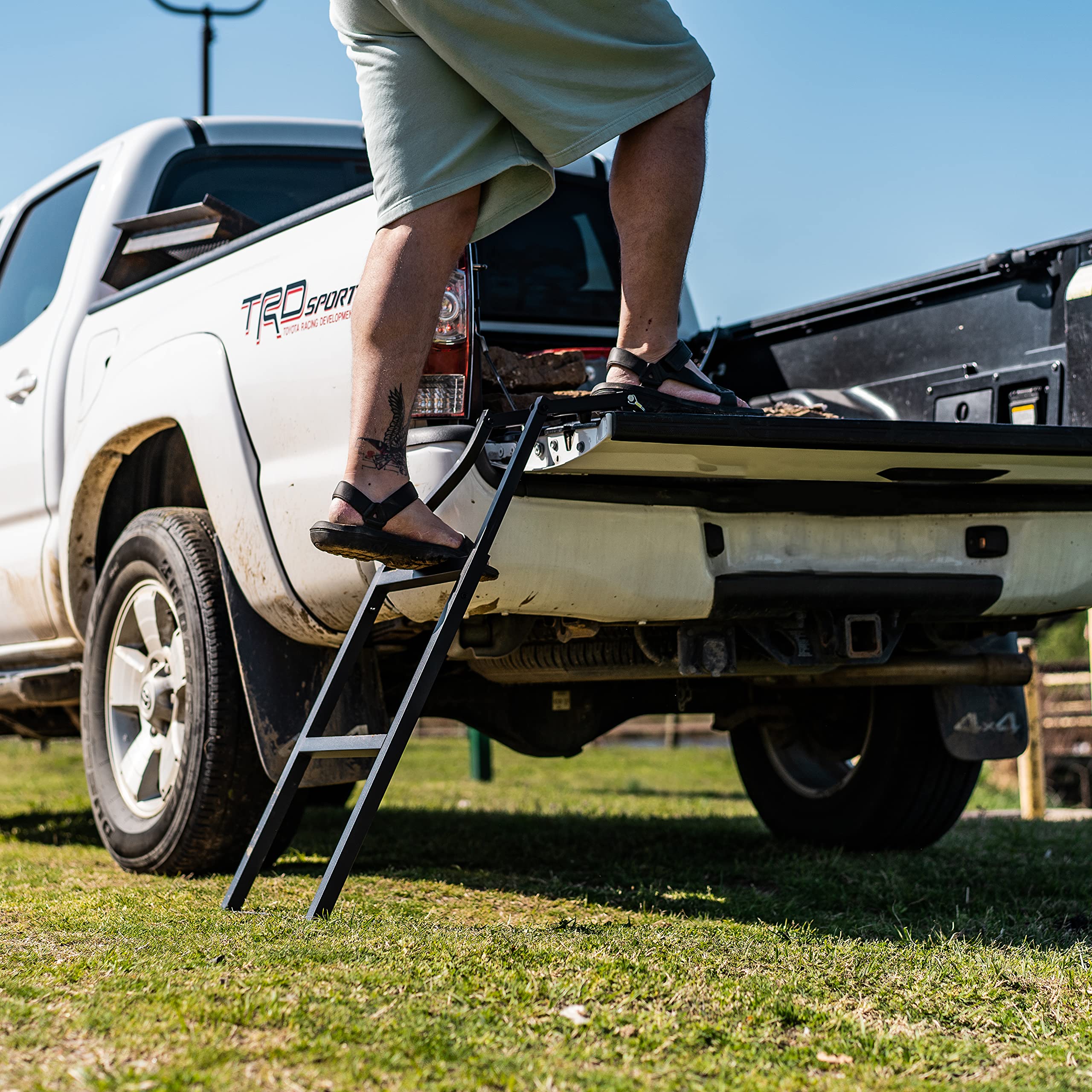 Traxion ladder next to person for scale demonstrating size and fit benefit
