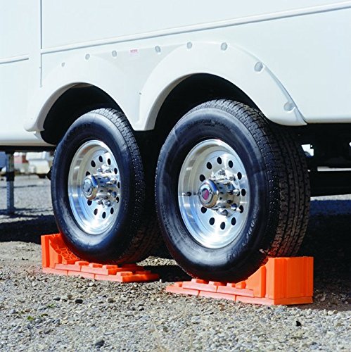 Tri-Lynx chock contacting RV tire to show repeatable positioning benefit