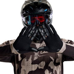 Rider wearing Troy Lee Designs Air Glove using motorcycle handlebar, improving grip and control