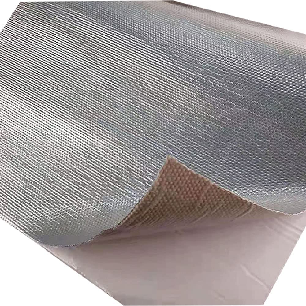 Ummickl mat used behind a kitchen stove in workshop scene reducing surface heat exposure