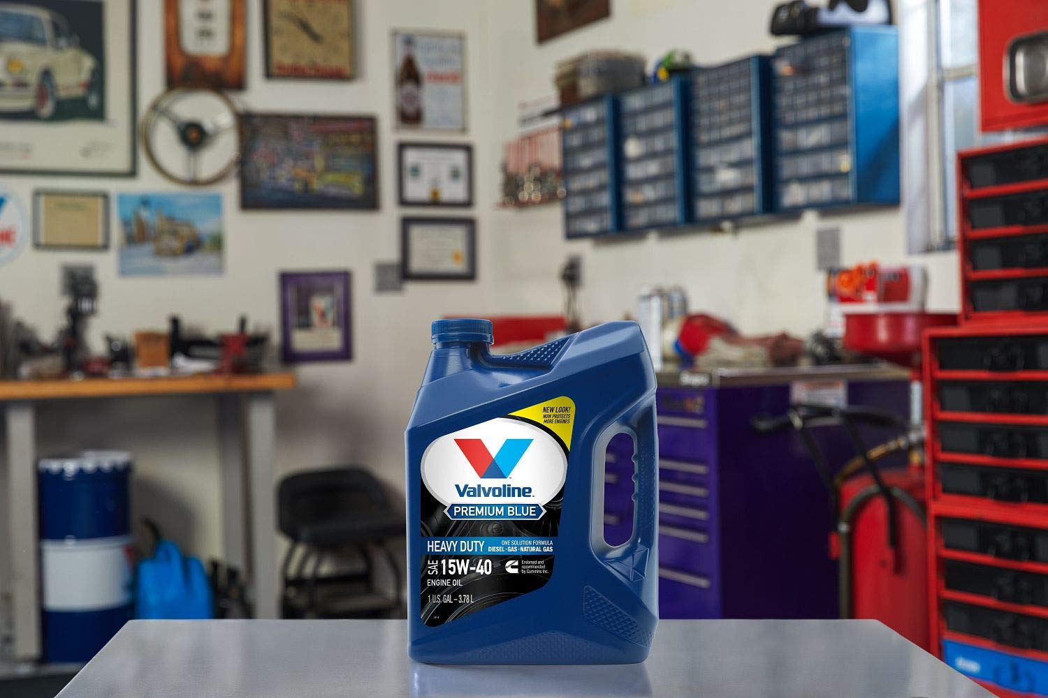 Valvoline Premium Blue displayed beside a working truck in a yard showing real-world performance benefit