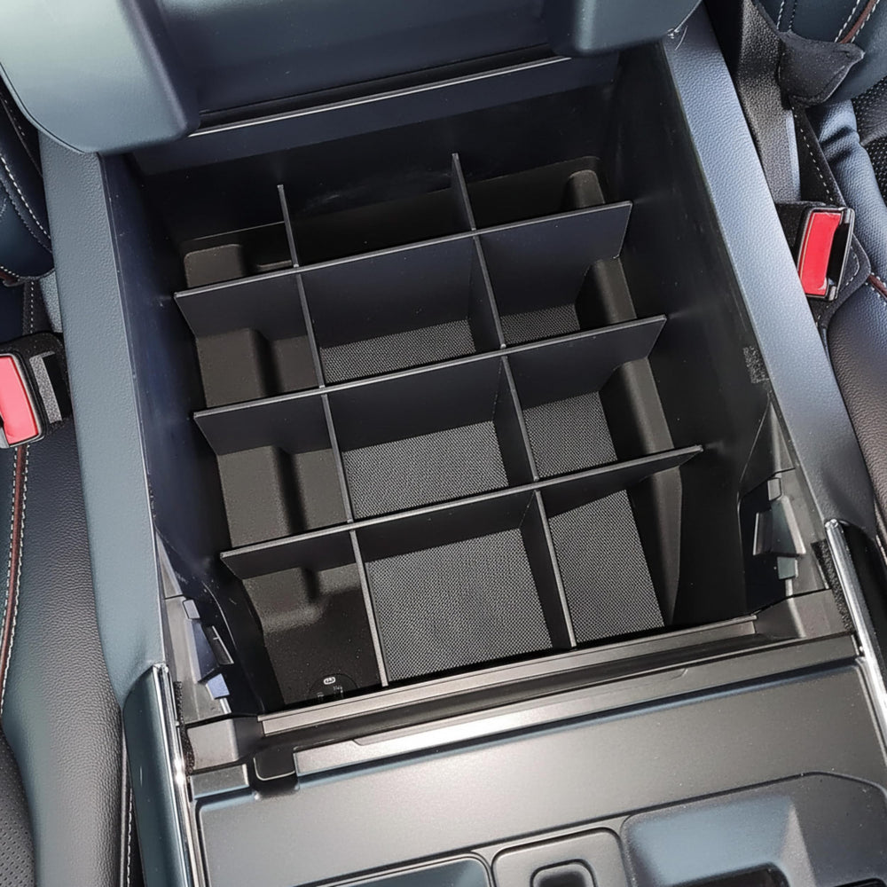 Vehicle OCD size comparison with coins and pen showing compartment scale and utility