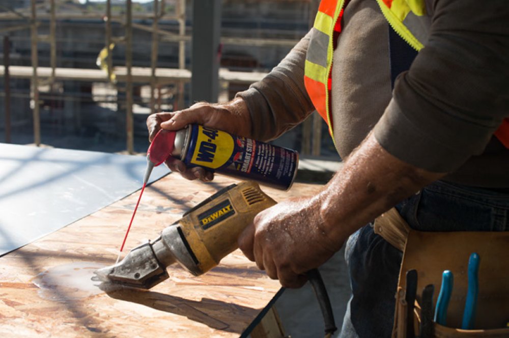 WD-40 applied to a rusted bolt showing freed hardware and efficient penetration