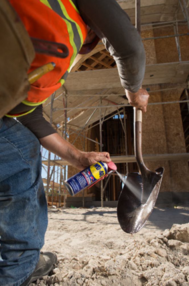 WD-40 on a metal tool showing protective film that helps prevent moisture damage