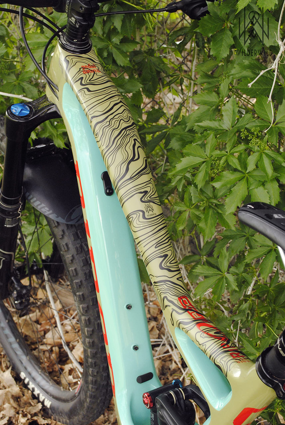 WilderWild bike on trail with protection tape demonstrating durable use