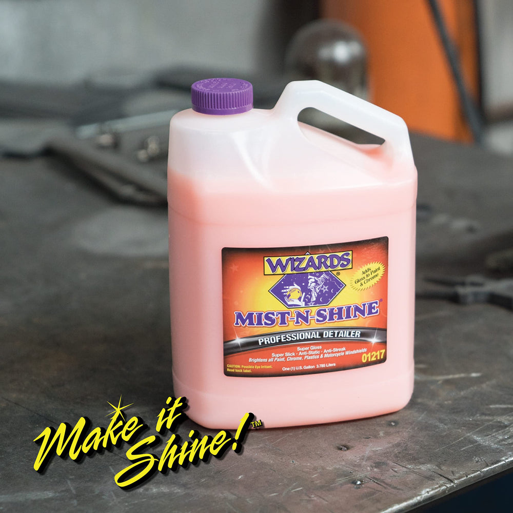 Wizards bottle being used on windshield to remove light film and improve clarity