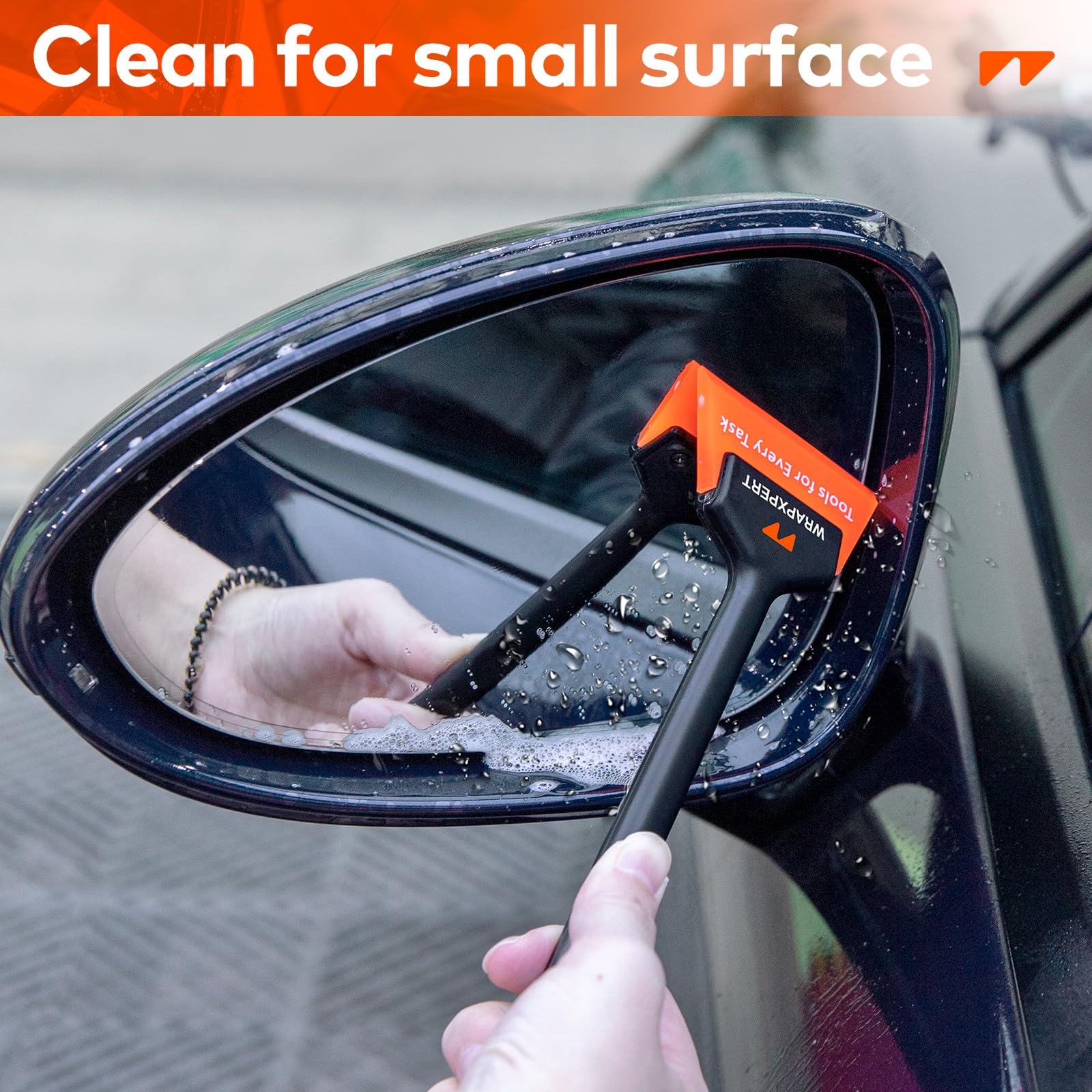 WRAPXPERT squeegees held in hand showing size and ergonomic grip for steady control
