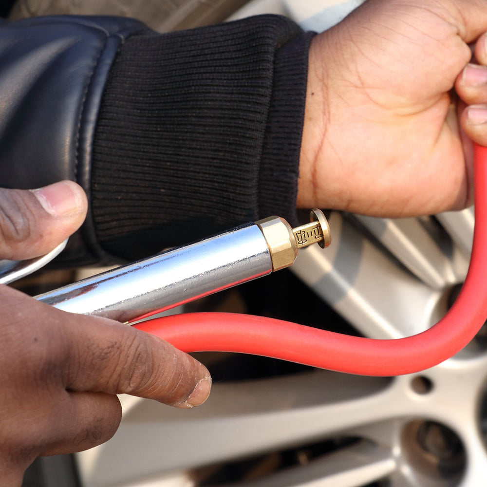 WYNNsky inflator in use on car tire offering quick inflation and dependable pressure control