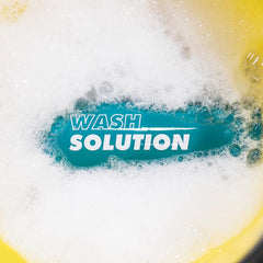 Hand holding XPEL bottle over bucket demonstrating easy measuring and mixing