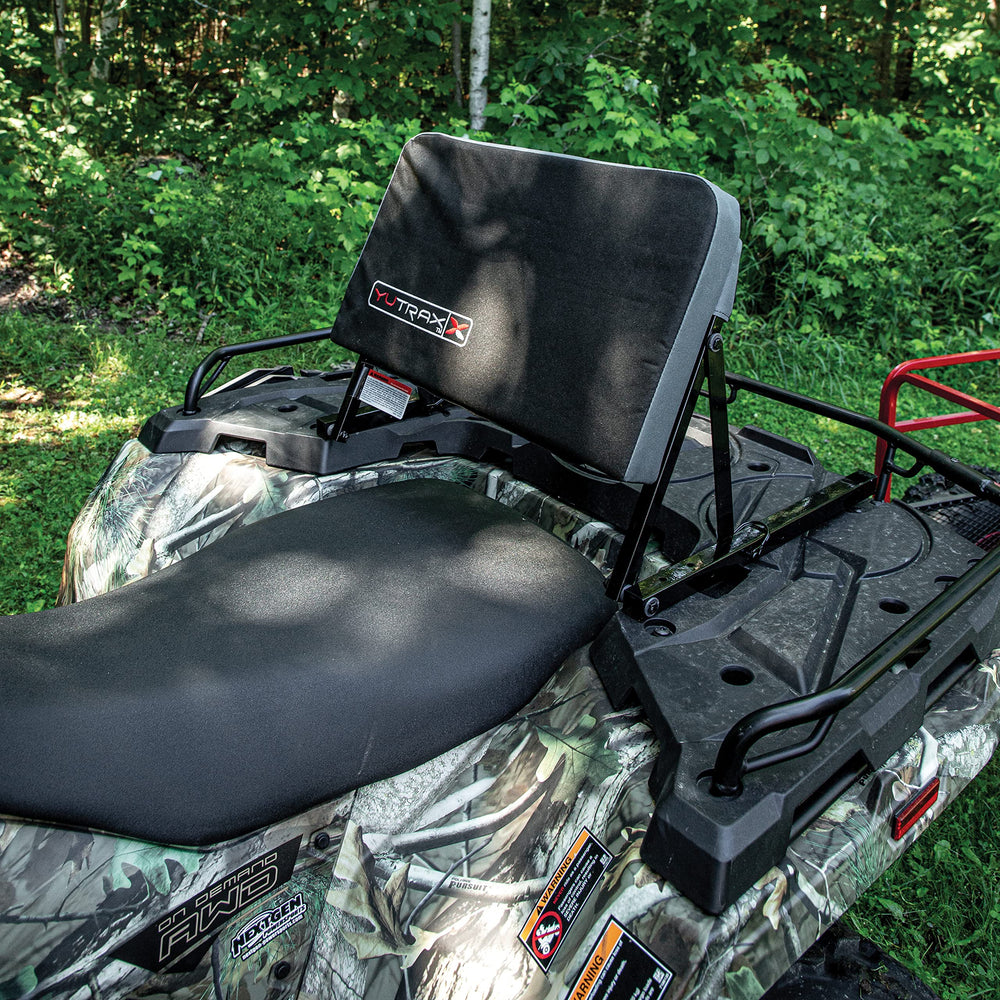 Yutrax backrest folded flat on rack showing compact profile and trail-ready convenience